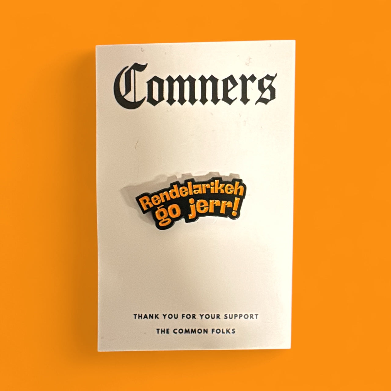Comners Enamel Pin